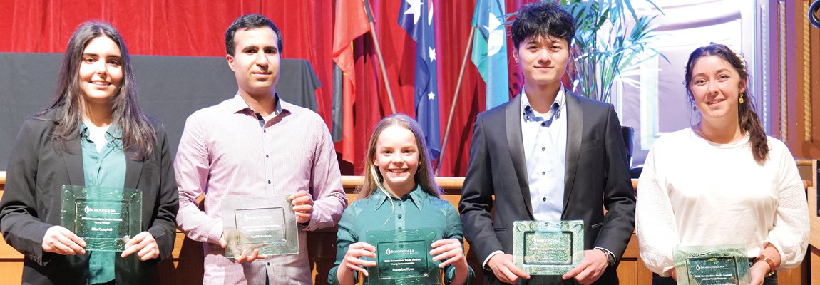 5 young people standing together holding their Boroondara Youth Award trophies
