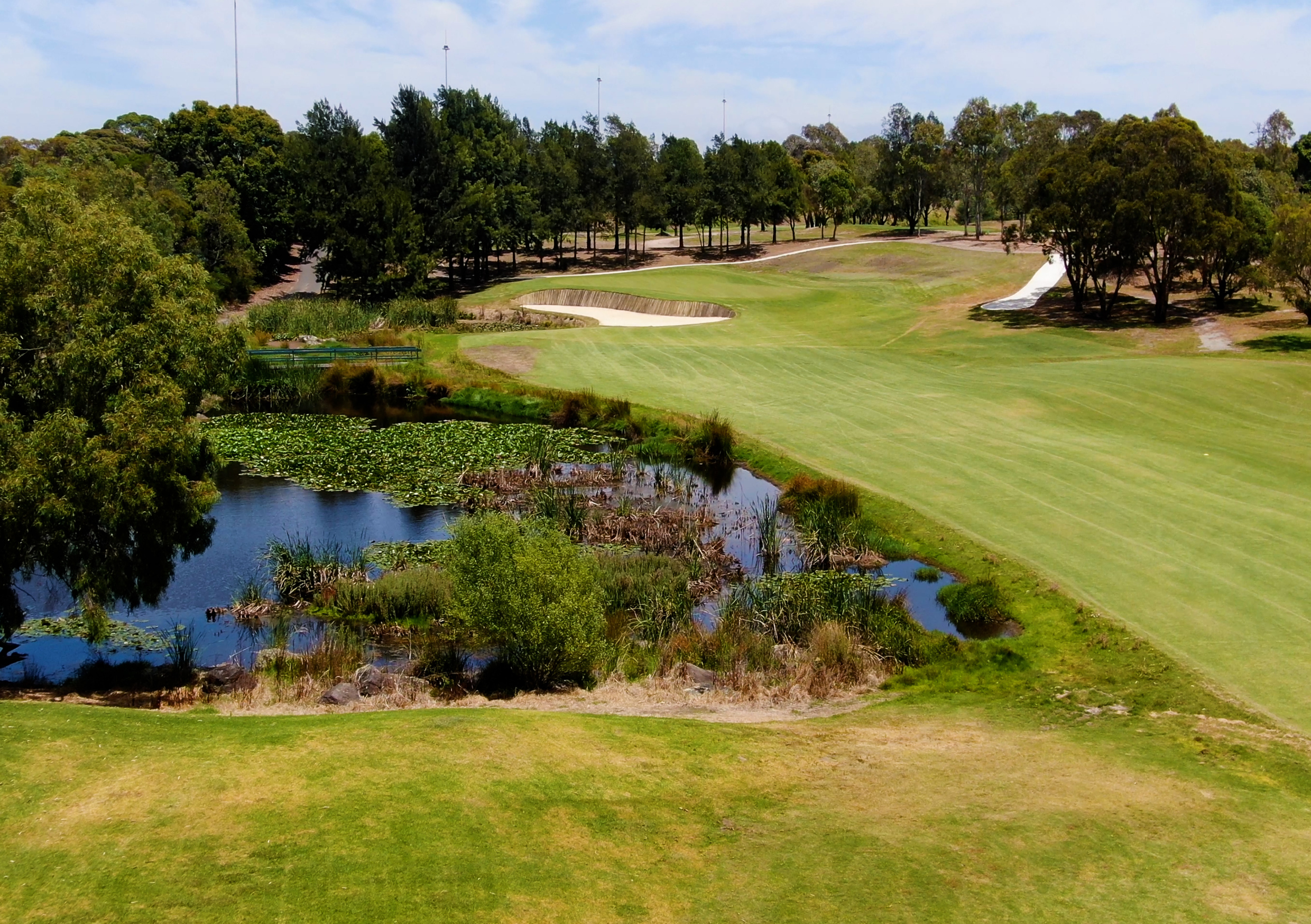 The freeway golf course showing the well kept fairway and surrounding waterway