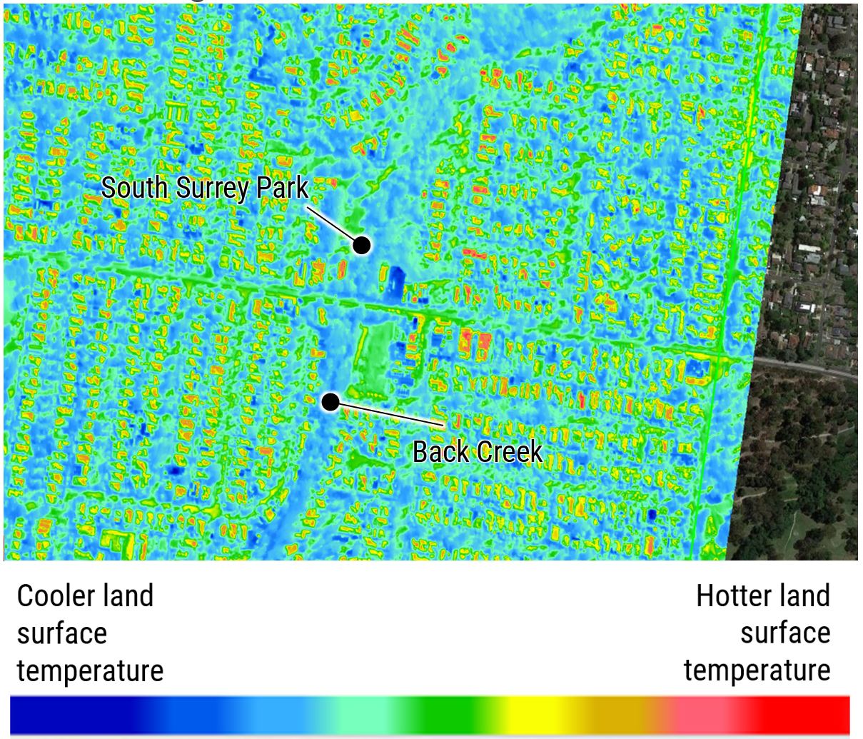 Aerial image of land in Boroondara depicted in a blue to red scale showing cooler or warmer land surface temperatures. The roofs of buildings appear to be the hottest surfaces. A blue-green strip of land along Back Creek is evident.