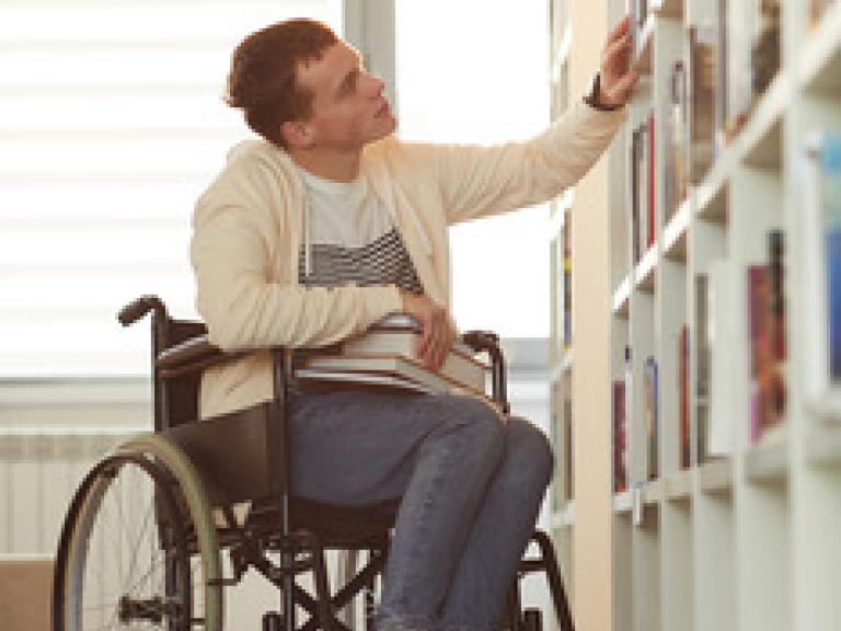 A person in a wheelchair at the library