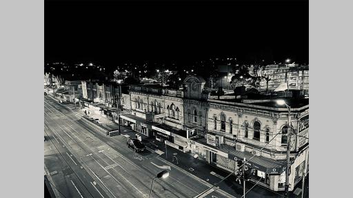 Photo by Susie Wilson looking down on Glenferrie Road at night showing an empty street