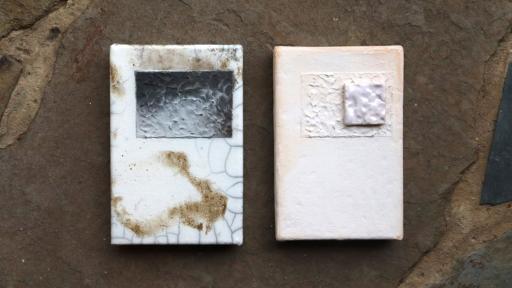 Two textured, abstract ceramic artworks