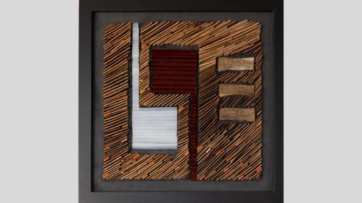 An artwork made of layered pieces of wood with three horizontal pieces flat in a line on the right of the canvas, and two shapes like musical noted mirroring each other vertically on the left of the canvas, one is white and one is red-brown