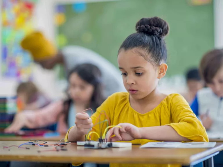 Child experimenting with electronics.