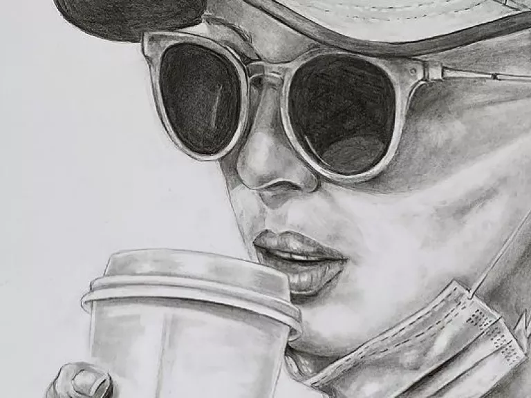 Graphite drawing of of a woman wearing a cap and sunglasses. She is drinking a takeaway coffee and has a mask pulled down under her chin.