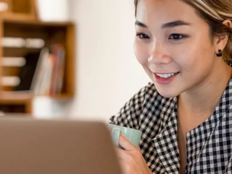 woman sitting on a laptop