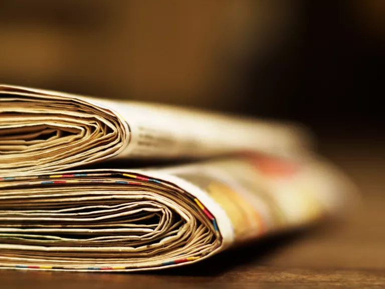 Old newspapers on a table