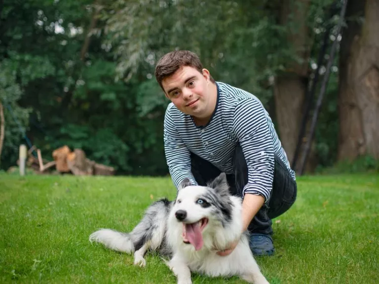 A person with their dog in the park