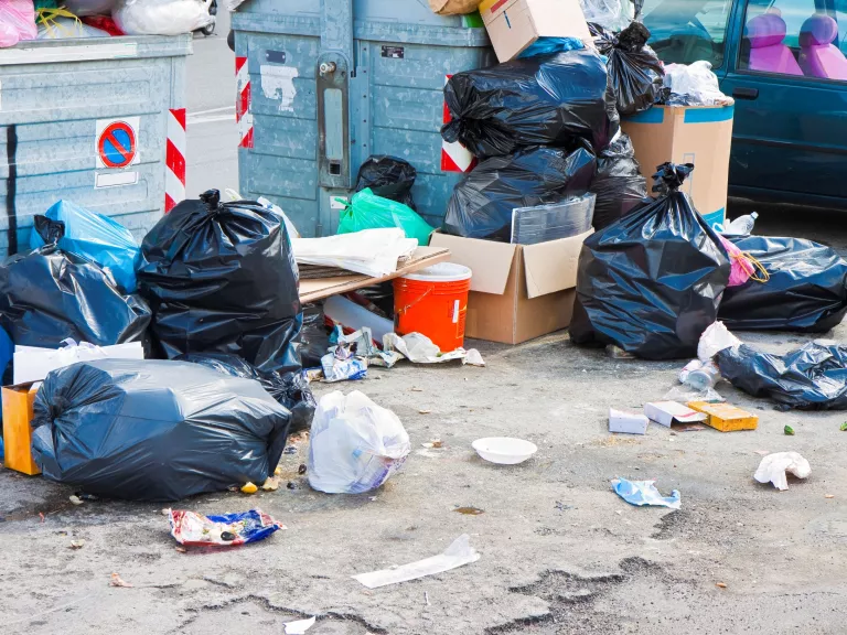 A pile of dumped rubbish on the street