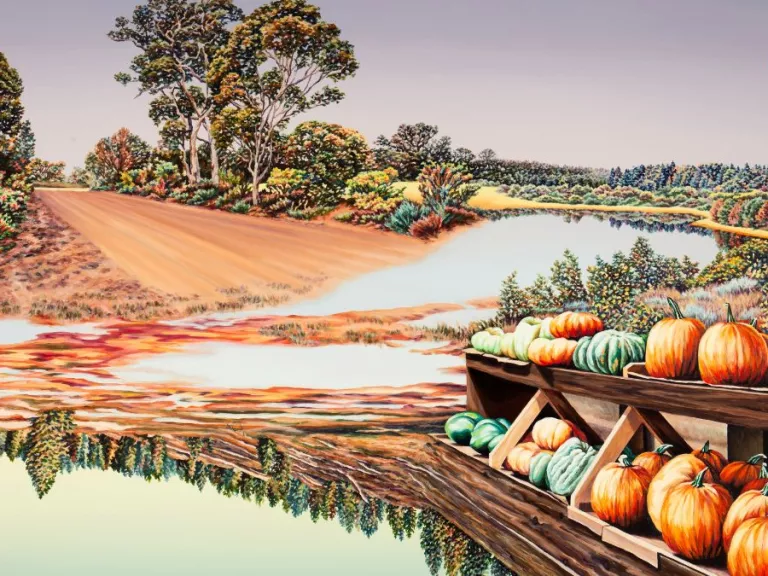 A landscape painting featuring pumpkins and a lake in the foreground, with a red dirt road and gum trees in the background.