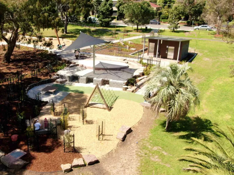 Aerial view of playground area including a climbing frame and sandpit
