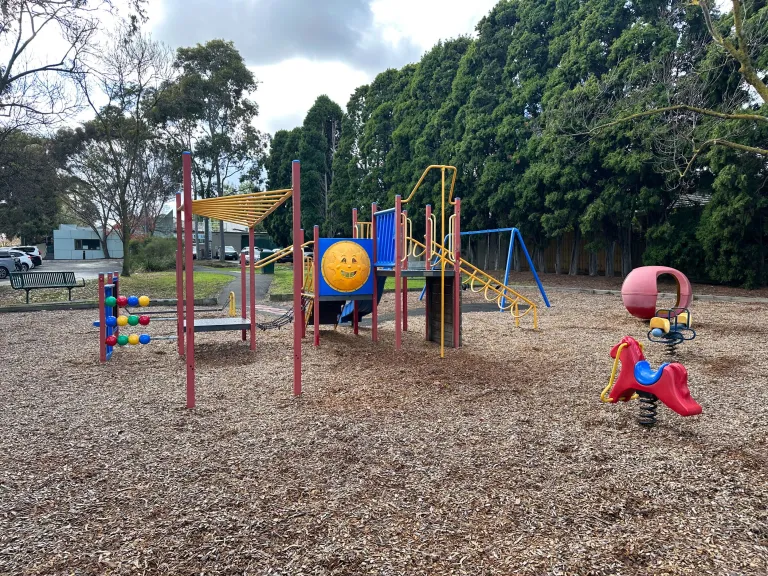 A small playground with colourful climbing equipment