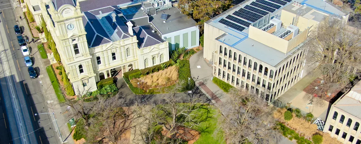 Overhead photo shows Boroondara Civic Precinct with Camberwell Road at left and trees in foreground.