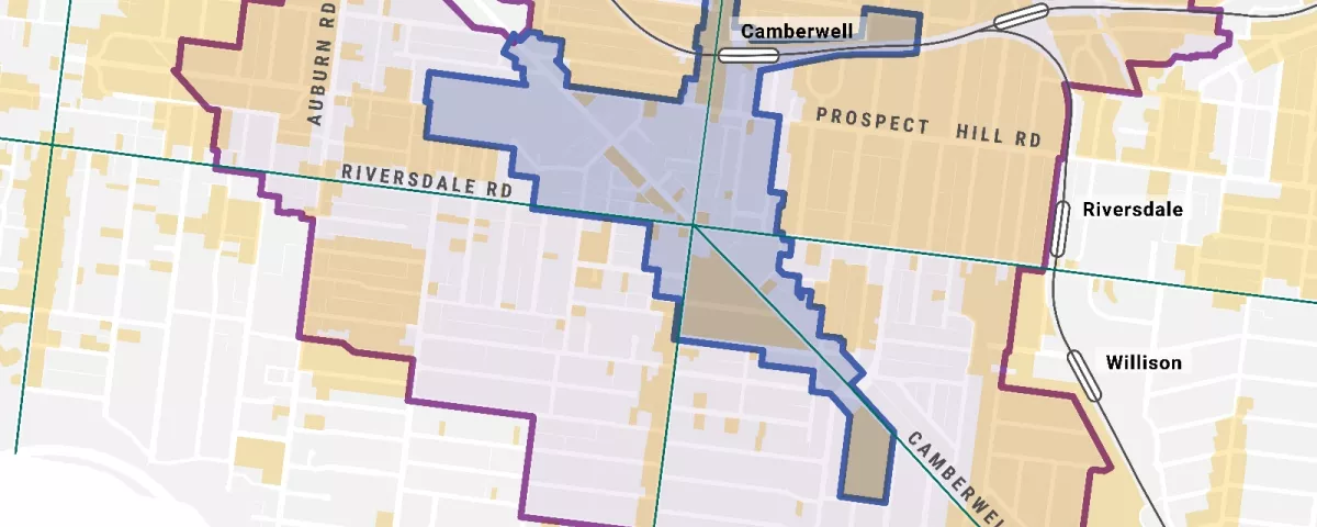 The image is a map of the Camberwell area in Melbourne, Australia. The map includes the following: - The boundaries of the Camberwell Junction Activity Centre. - The boundaries of the Camberwell Junction catchment area. - Heritage overlays. - Tram routes. - Train lines and stations. - The names of several surrounding areas like Glenferrie, Auburn, Riversdale, and Hartwell. - The names of several roads, including Barkers, Burke, Auburn, Prospect Hill, and Toorak.