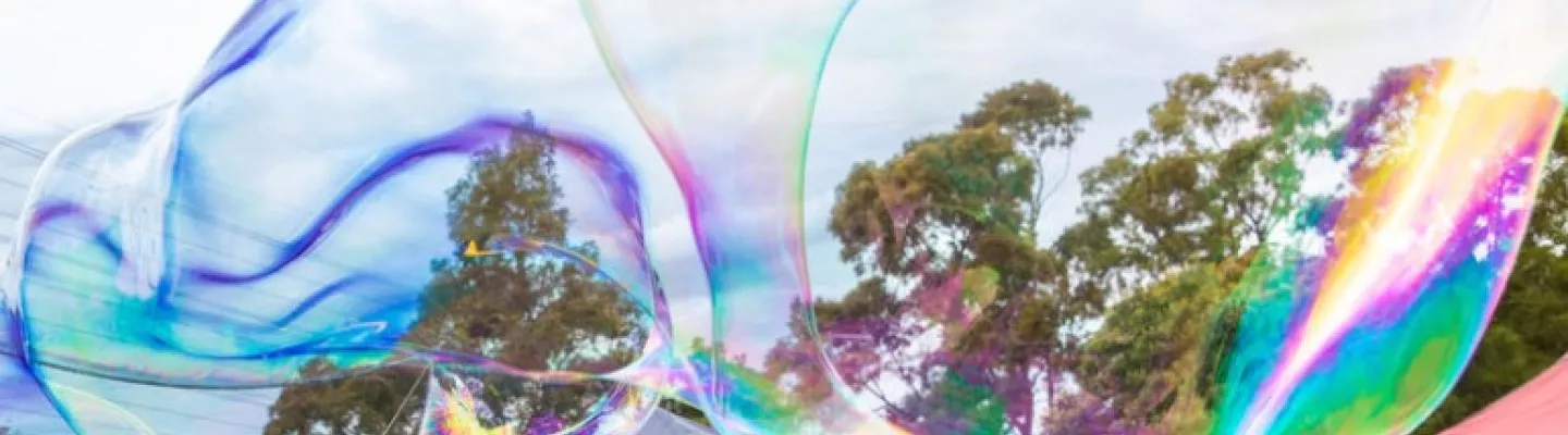 large bubbles against a cloudy sky