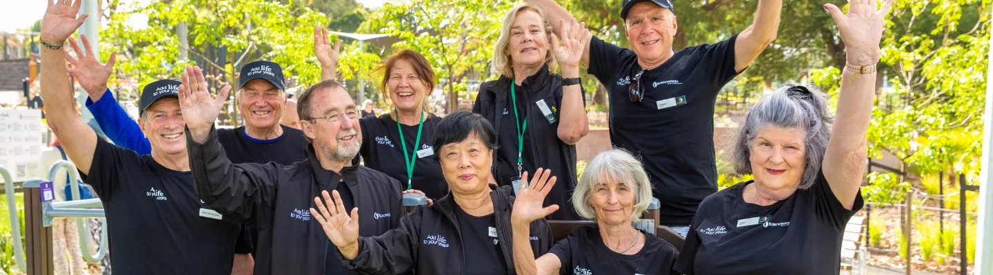 A group of older people fist pumping happily