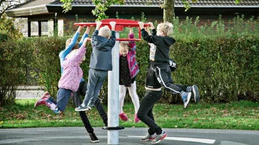 A bunch of kids handing off a sky carousel