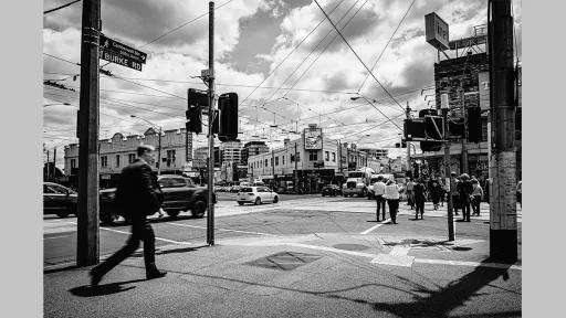 Photo by Nadja Arold of the Camberwell Junction intersection while busy, with cars and people crossing