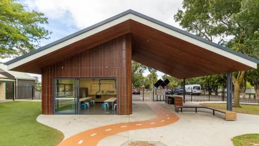 Outside the party room at the Kew Traffic School showing the wooden structure, the undercover area beside the party room and the painted road leading to the area.