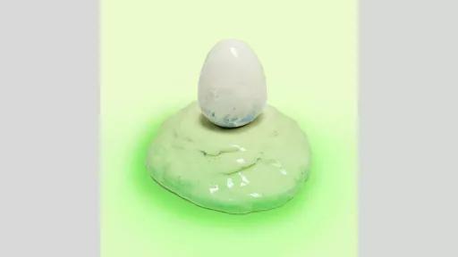 Ceramic sculpture of a white egg on a light green mound. 