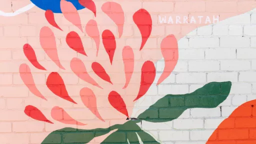 A mural showing a warratah flower with bright colours behind it