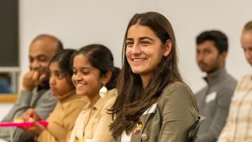 A group of young people sitting in an audience