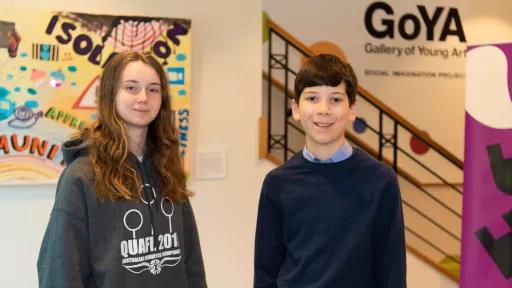 A boy and girl stand outside the Gallery of Young Art