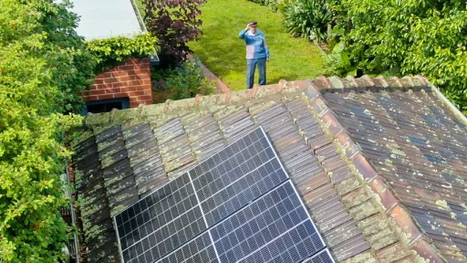 Overhead photo showing solar panels on a roof and 