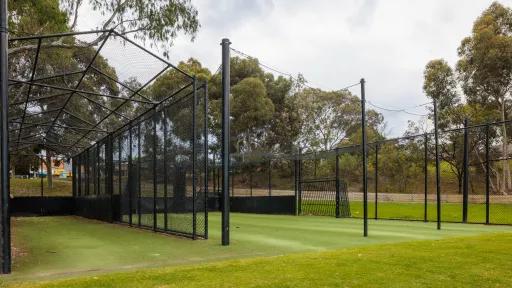 Outdoor cricket lanes with green turf