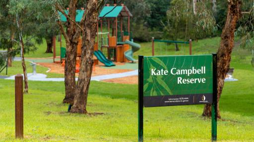 A sign in a park says Kate Campbell Reserve