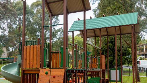 A small timber climbing wall at a playground