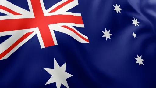 The Australian flag. A blue flag with the red and white crosses of the union Jack, the white Commonwealth star representing the states and territories and the 5 stars of the southern cross constellation