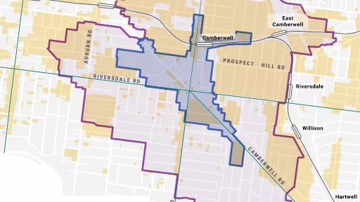 The image is a map of the Camberwell area in Melbourne, Australia. The map includes the following: - The boundaries of the Camberwell Junction Activity Centre. - The boundaries of the Camberwell Junction catchment area. - Heritage overlays. - Tram routes. - Train lines and stations. - The names of several surrounding areas like Glenferrie, Auburn, Riversdale, and Hartwell. - The names of several roads, including Barkers, Burke, Auburn, Prospect Hill, and Toorak.