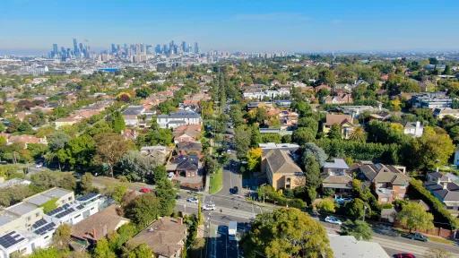 arial view of suburban houses and streets above Kew, looking towards the city