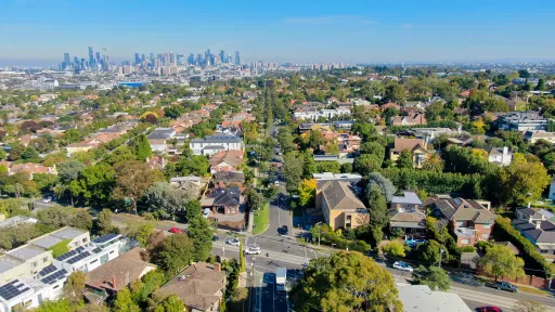 arial view of suburban houses and streets above Kew, looking towards the city