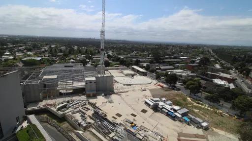 A construction site with a crane in the background