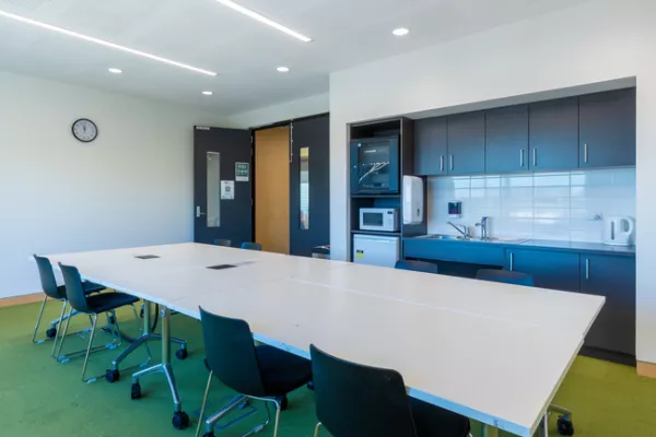 A large table takes up most of a meeting room